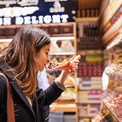 Smelling food in market
