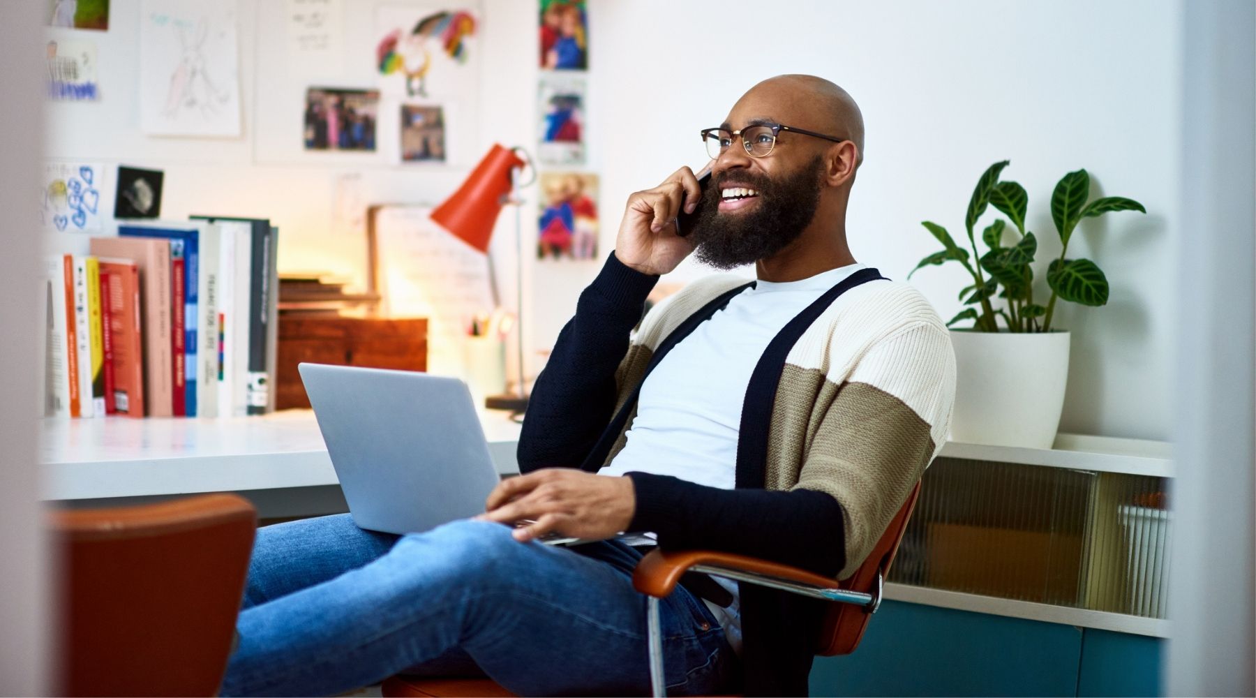 CheerfulManInHomeOffice_1800x1000_Getty