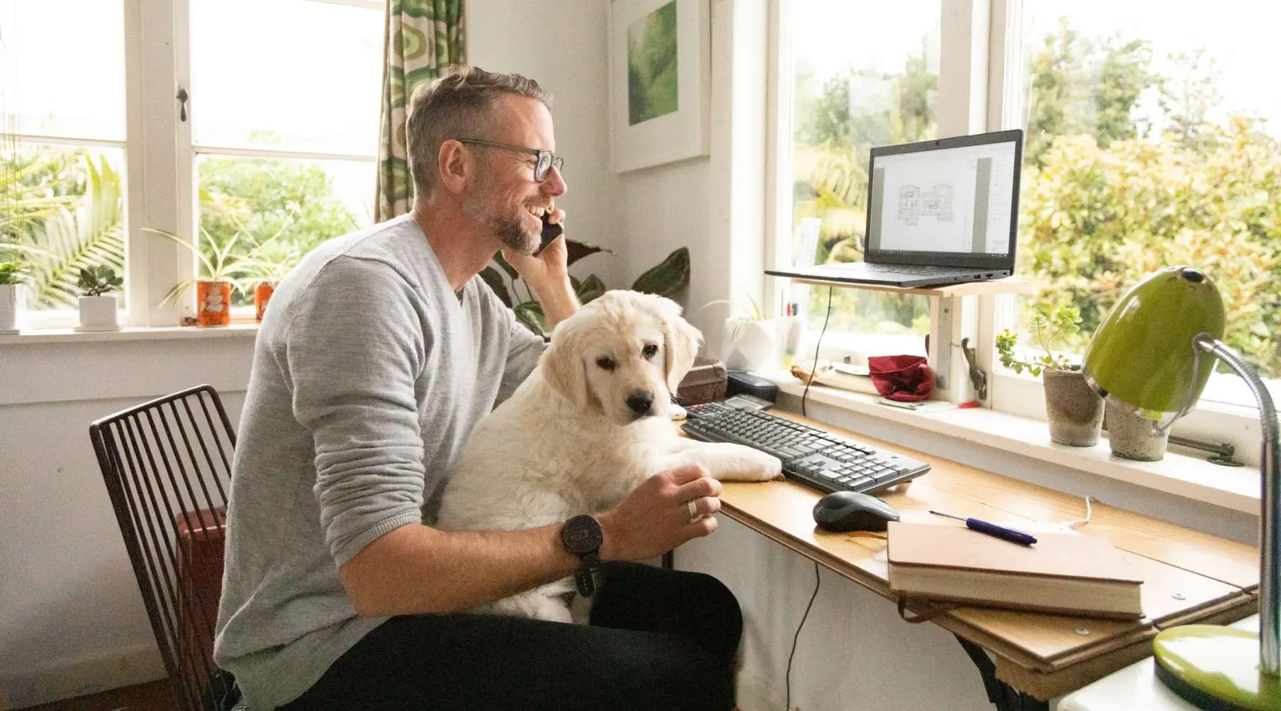 Man and dog working from home