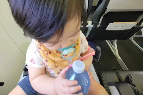 Baby playing on the plane