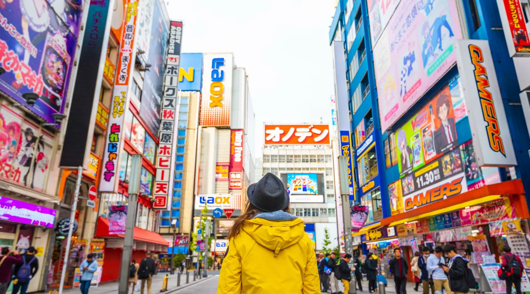 lady with yellow jacket standing in tokyo