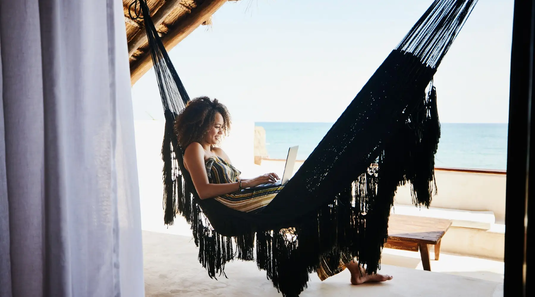 woman on a hammock by the sea