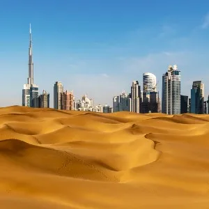 desert with Dubai buildings in the background