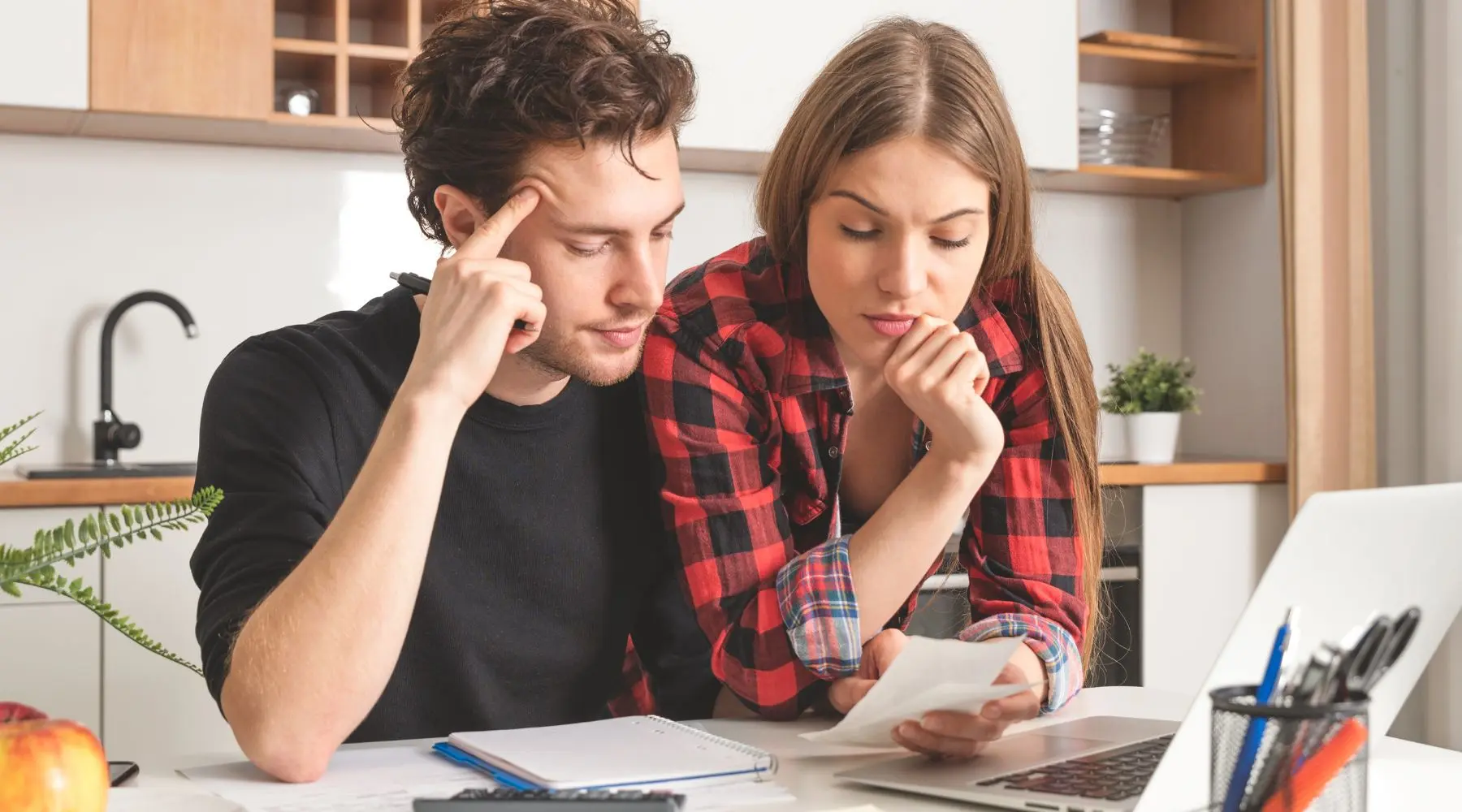 Stressed couple_Canva_1800 × 1000