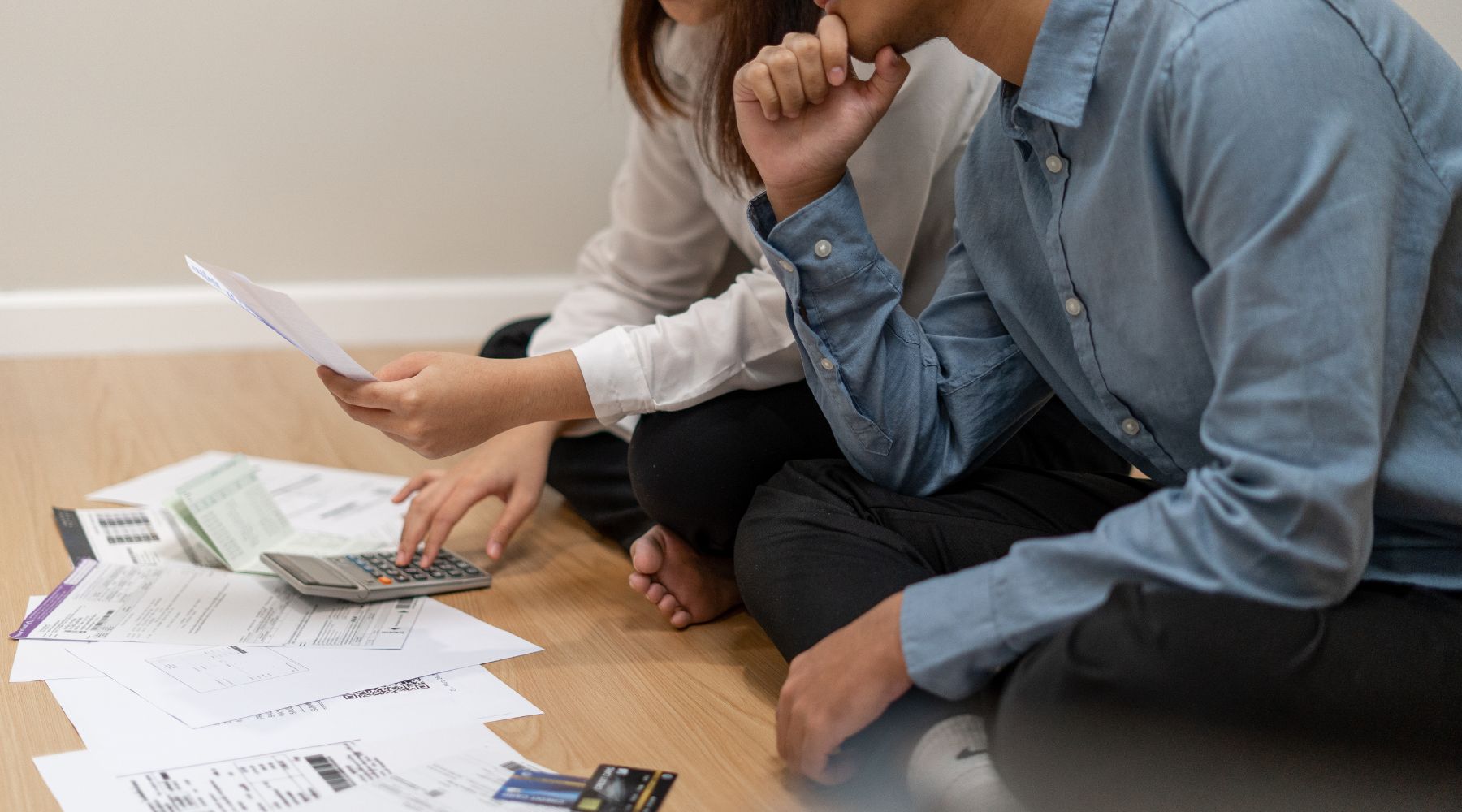 Couple paying bills_Canva_1800x1000