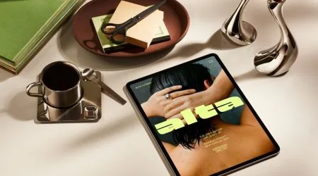 A collection of design tools and a digital magazine on a table 