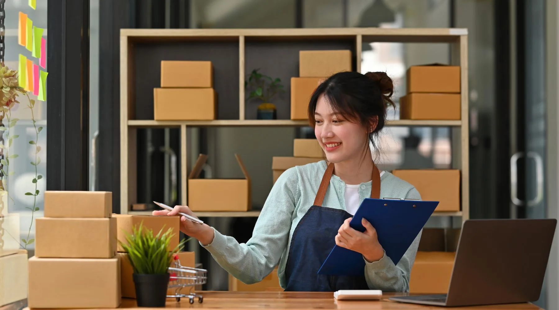 Business_Owner_Packing_Boxes_Canva_1800x1000