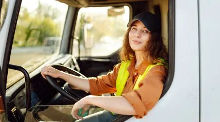 A woman driving a truck 