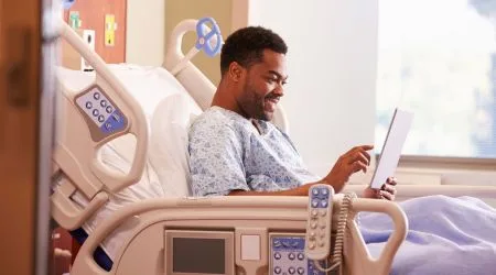A patient recovering in a hospital bed 