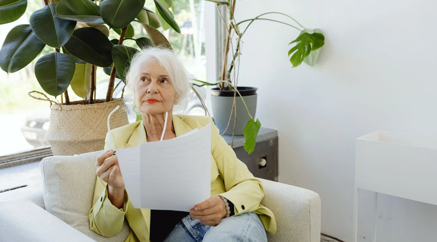 Eldlery_Woman_Reviewing_Financial_Documents_Canva_1800x1000 Eldlery_Woman_Reviewing_Financial_Documents_Canva_1800x1000