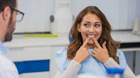 A happy woman at the dentist. 