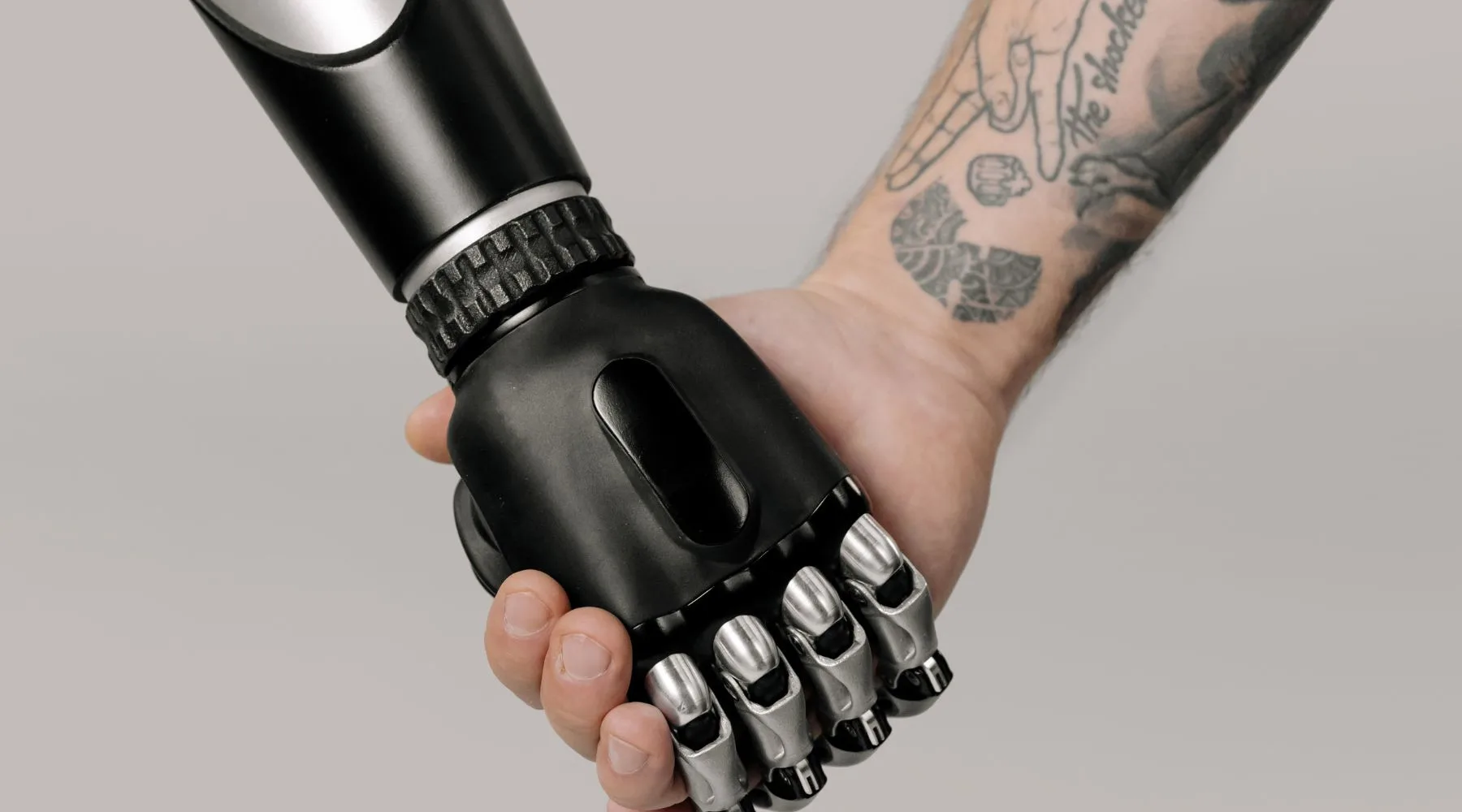 Robot and human hand_Canva_1800x1000