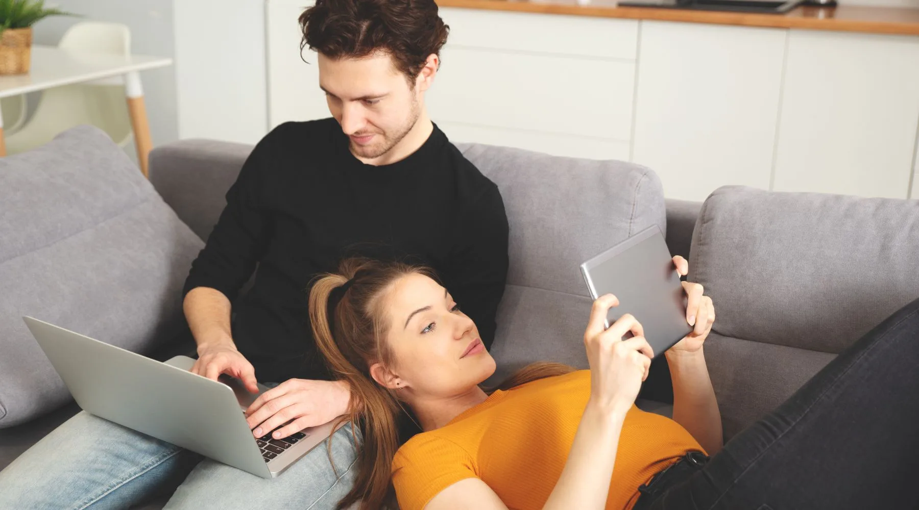 Couple_On_Devices_Checking_Finances_1800x1000