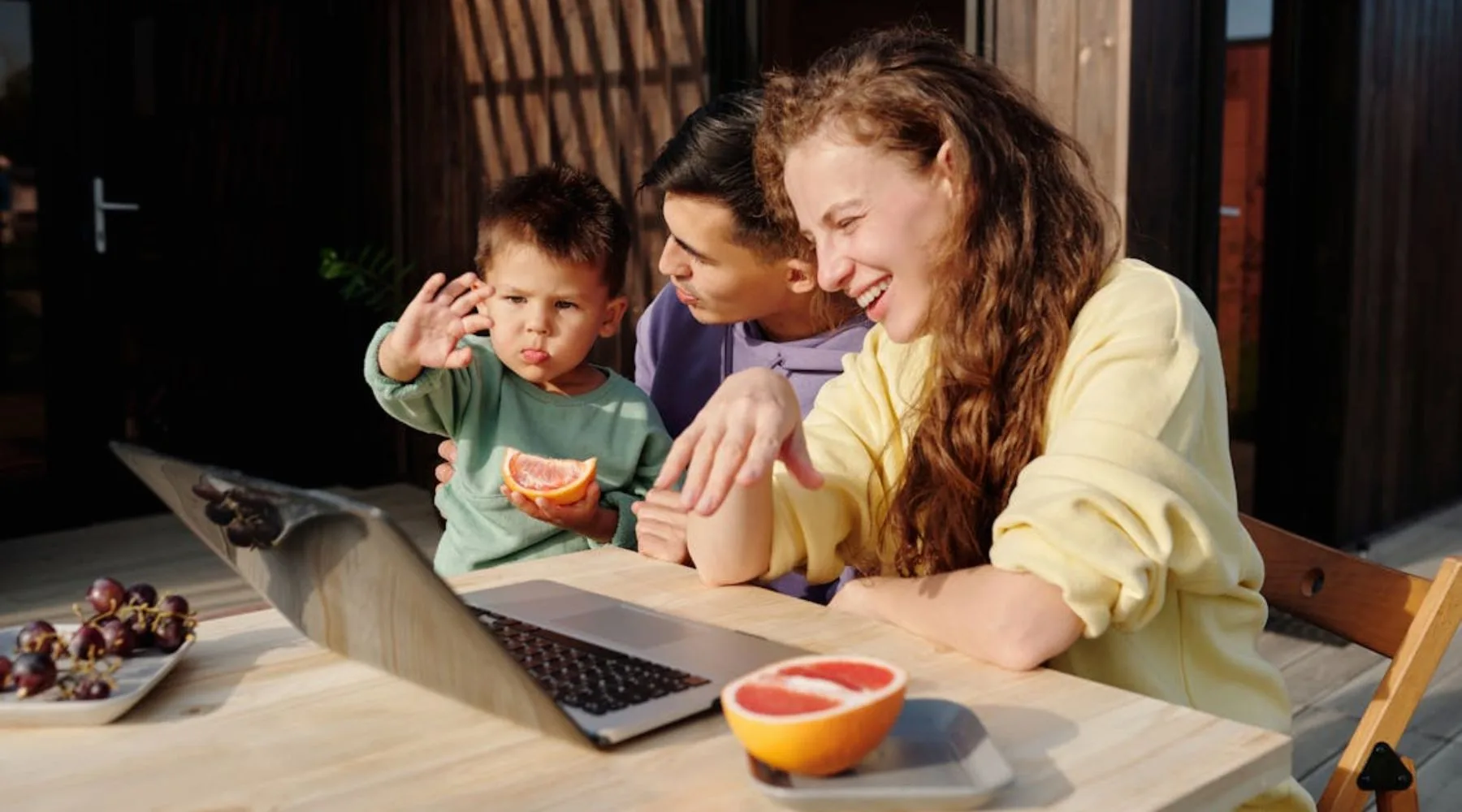 Family_Video_Call_Laptop_Outdoor_Table_Canva_1800x1000 Family_Video_Call_Laptop_Outdoor_Table_Canva_1800x1000