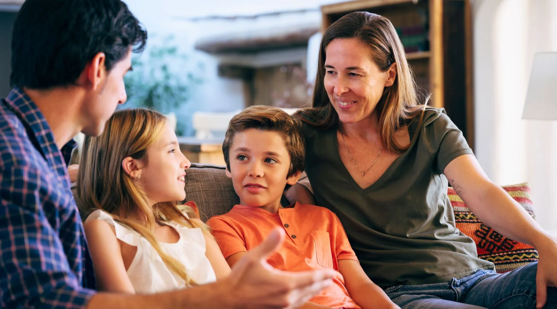 Father_And_Mother_Speaking_To_Young_Children_Canva_1800x1000 Father_And_Mother_Speaking_To_Young_Children_Canva_1800x1000