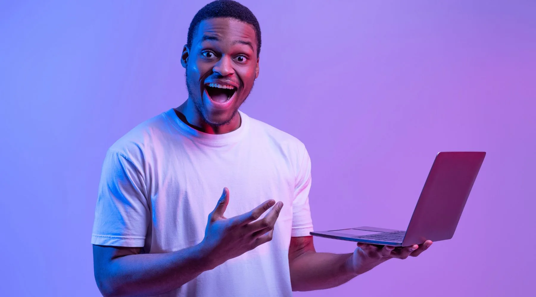 Man_With_Laptop_Purple_Lighting_Canva_1800x1000