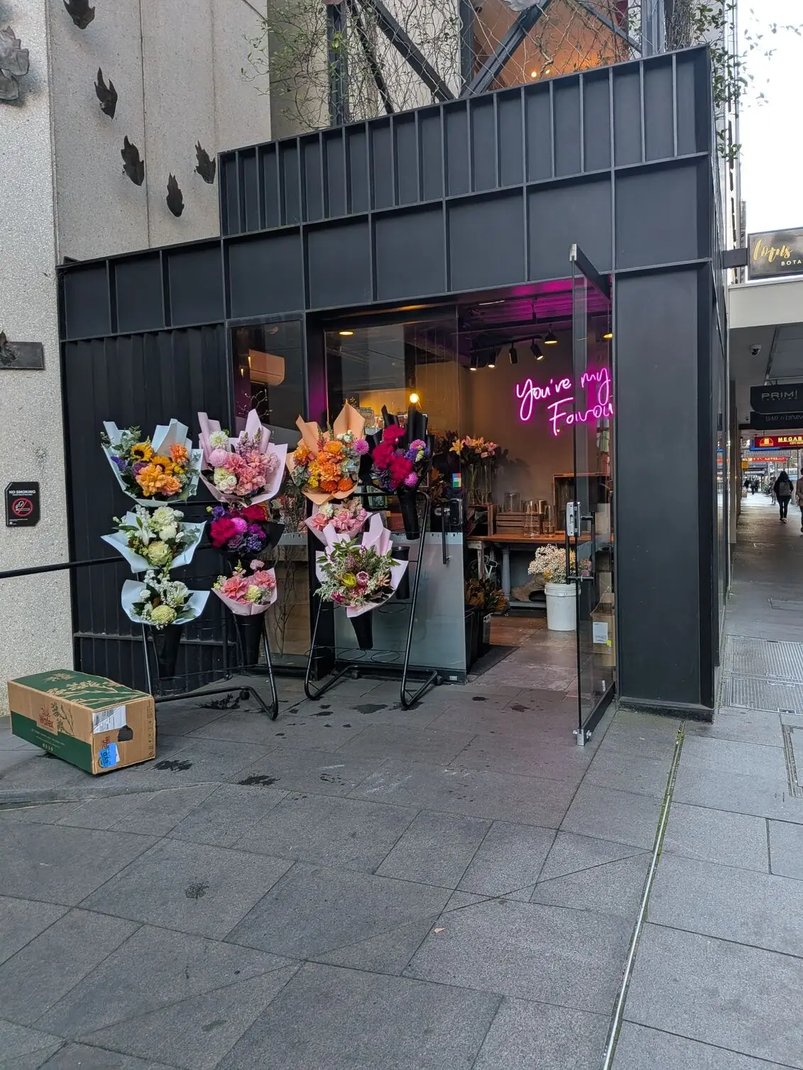 A vibrant storefront shot using the Google Pixel 10a of a flower shop with colourful bouquets displayed outside.