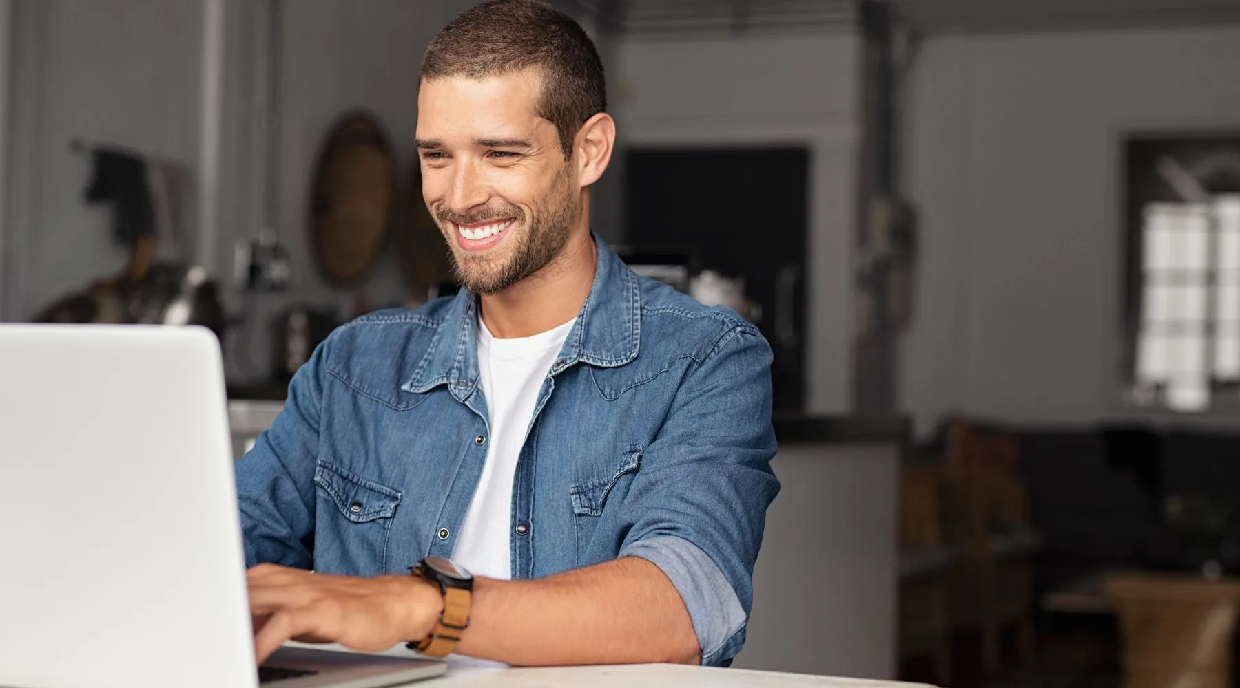 Happy_Man_Using_Laptop_Rustic_Setting_Canva_1800x1000 Happy_Man_Using_Laptop_Rustic_Setting_Canva_1800x1000