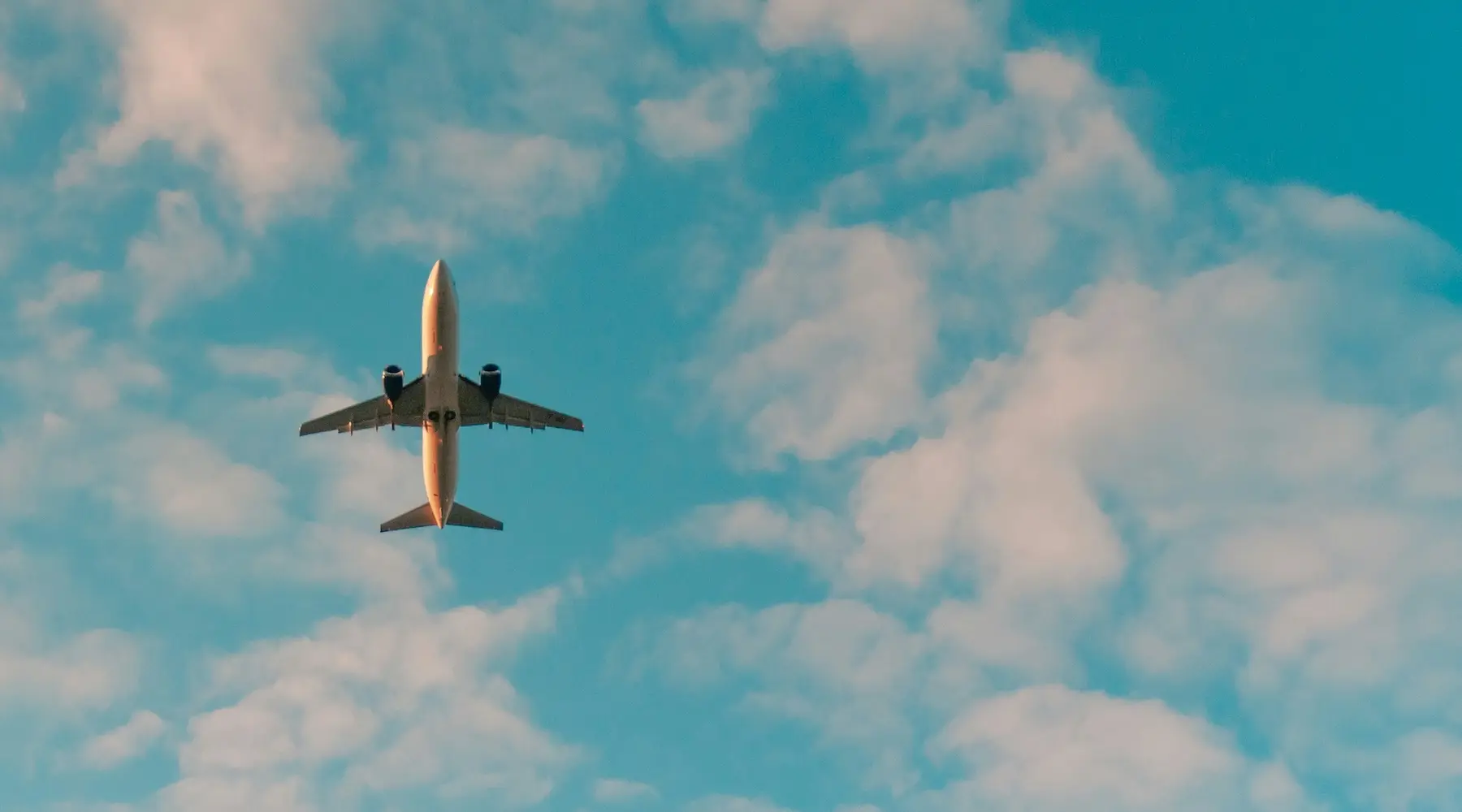 Plane flight flying_Unsplash philip-myrtorp_1800x1000