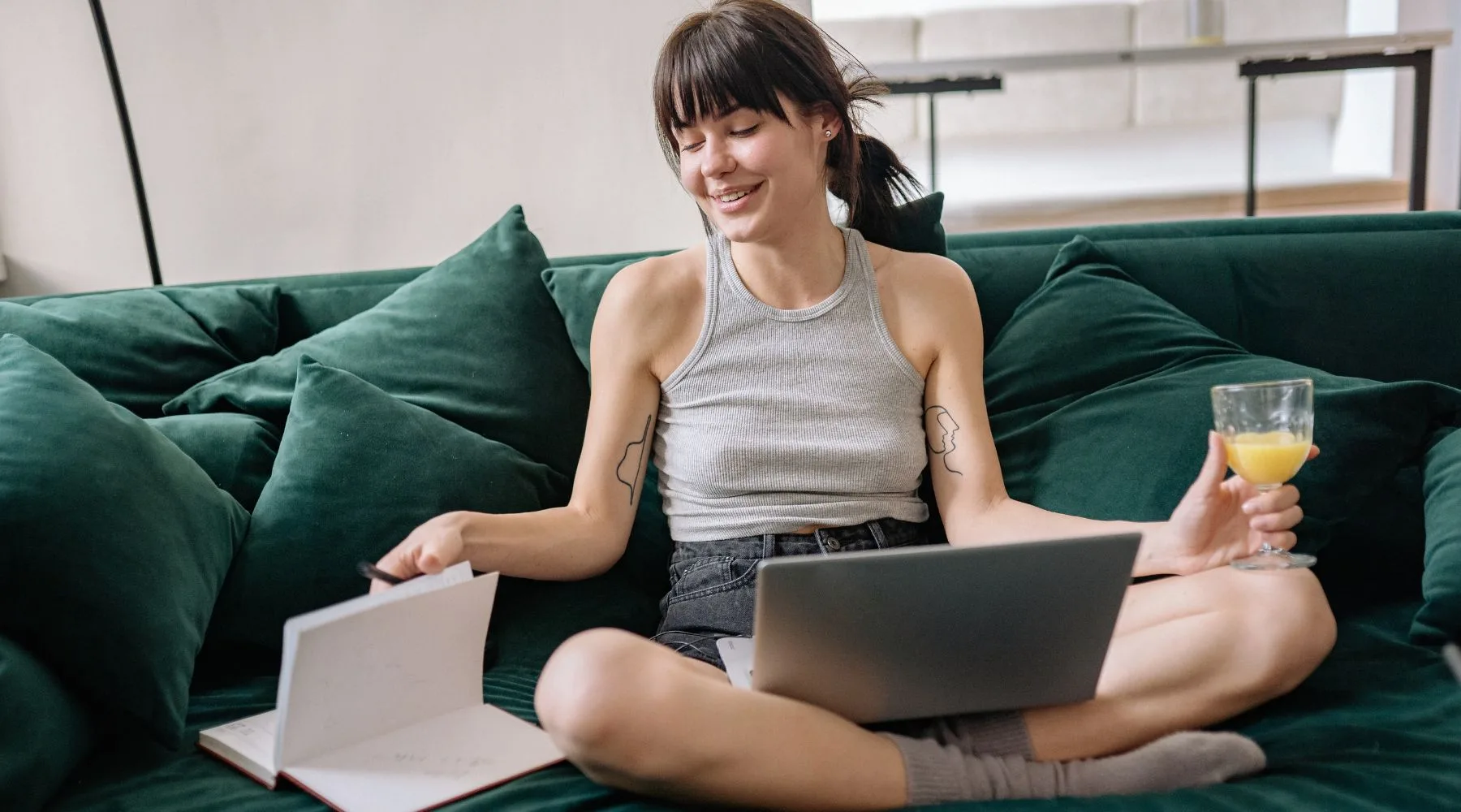 Young_Woman_Online_While_Reading_Book_Canva_1800x1000