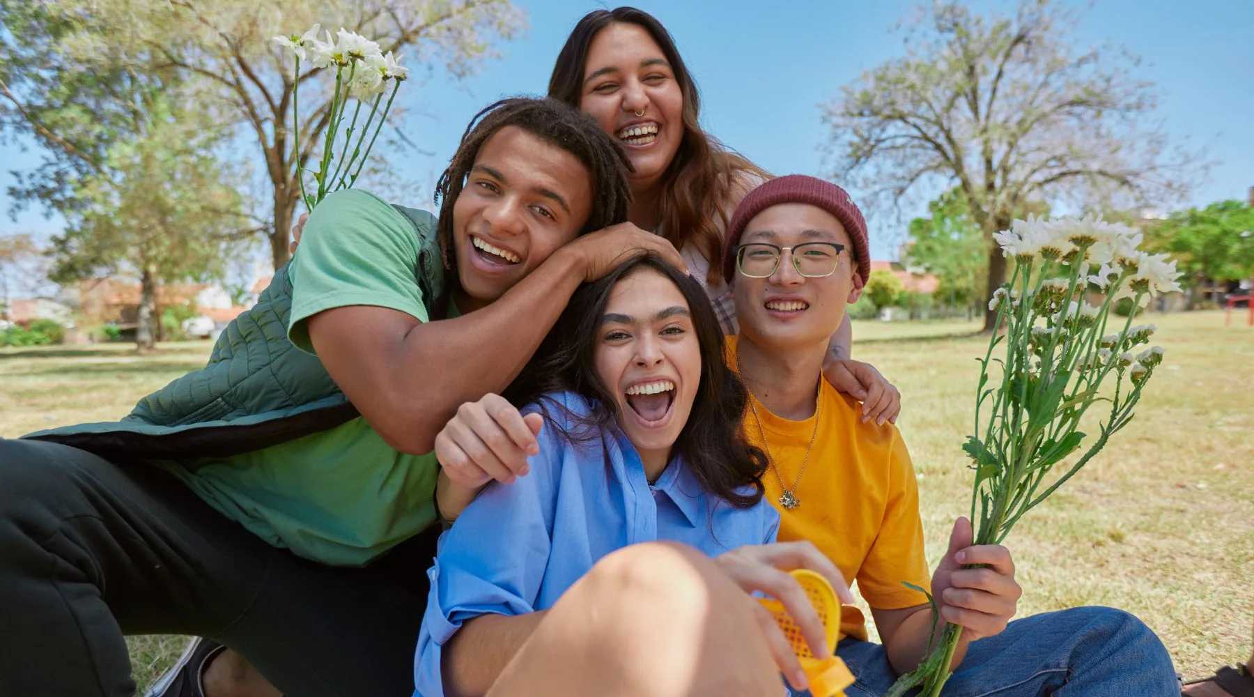 Group_Of_Happy_Friends_In_Park_Canva_1800x1000