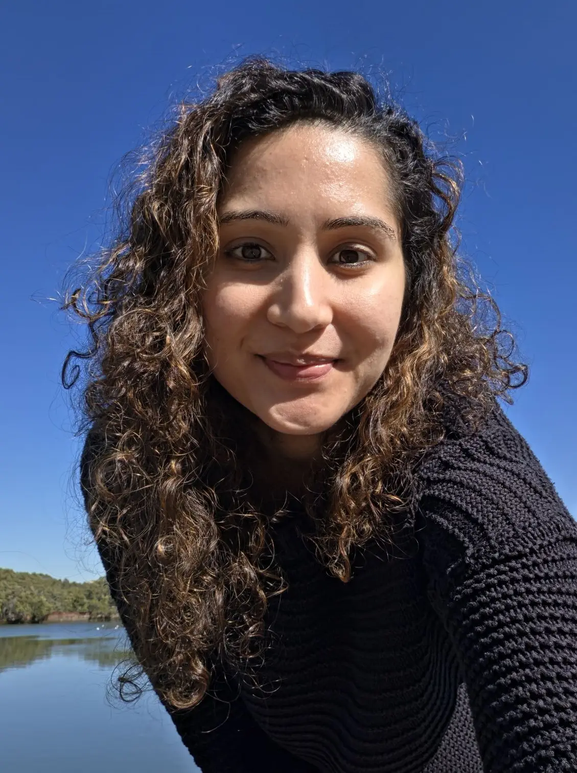 A close-up outdoor selfie taken with the Samsung Galaxy Z Fold 8's front camera, showing crisp detail against a bright blue sky.