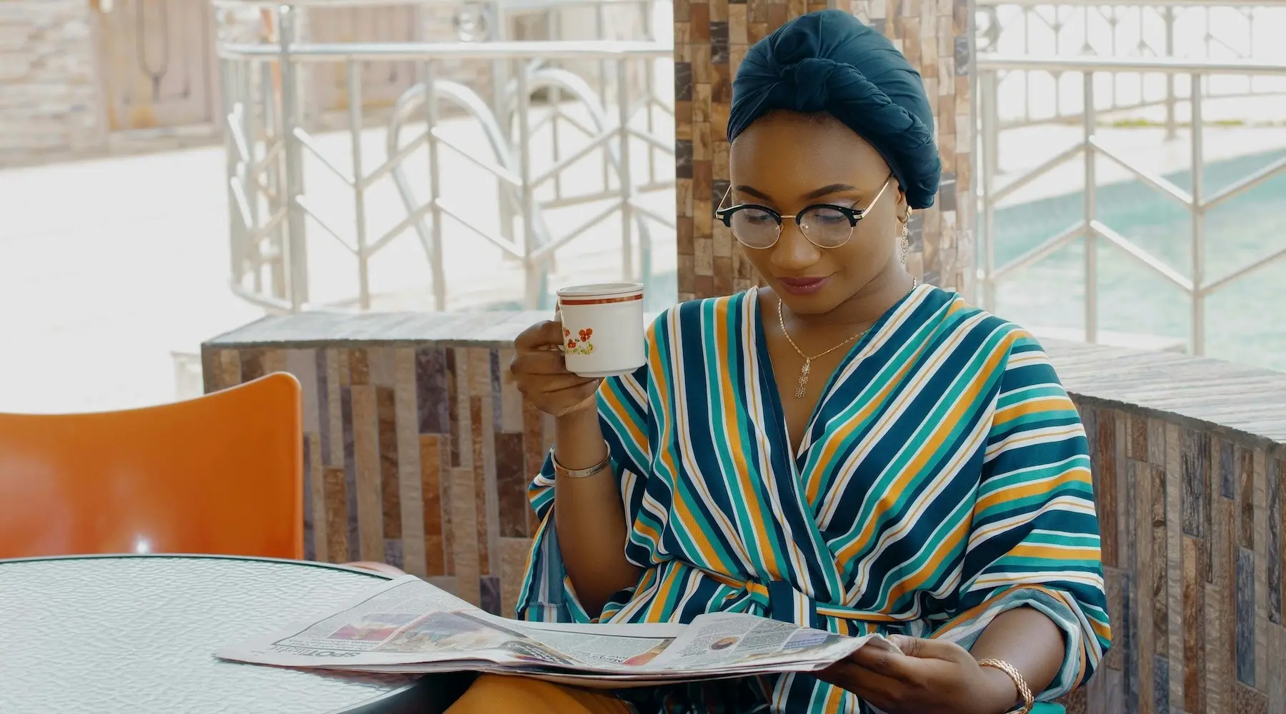 Woman coffee newspaper_Finder_1800x1000