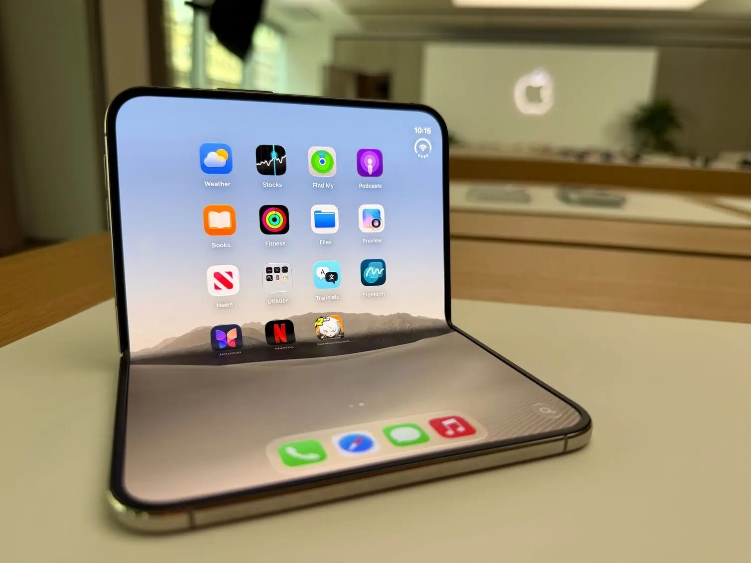 Image: Mariam Gabaji/Finder iPhone Duo standing open, its home screen apps stretched across the full inner display on a table.