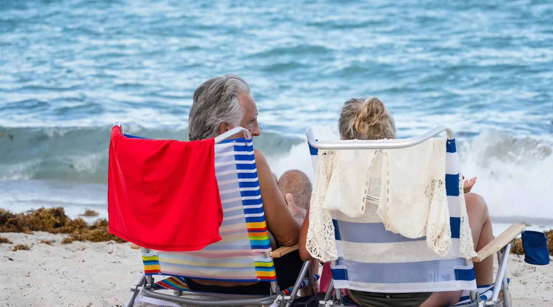 Couple at beach_Canva_1800x1000 (1)