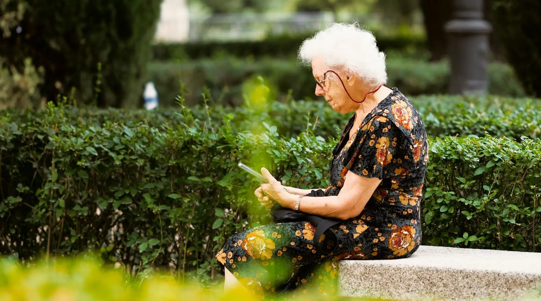 Older Lady Woman Phone Garden_Unsplash_1800x1000 Older Lady Woman Phone Garden_Unsplash_1800x1000