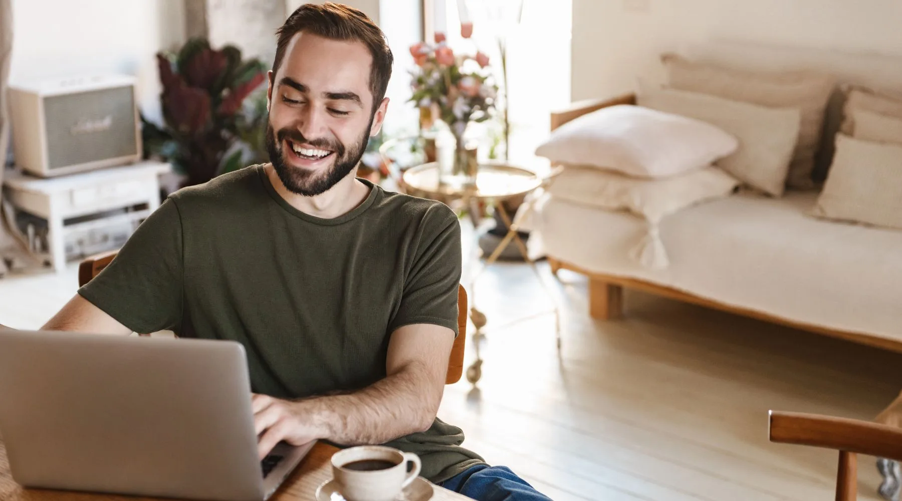 Happy_Man_Using_Laptop_Portfolio_Management_Canva_1800x1000