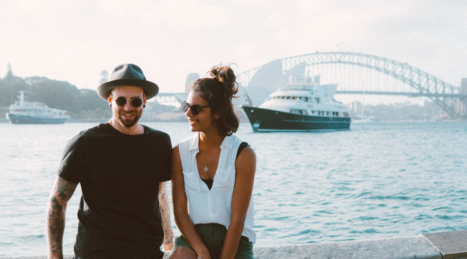 Tourists_Near_Harbour_Bridge_Canva_1800x1000 Tourists_Near_Harbour_Bridge_Canva_1800x1000